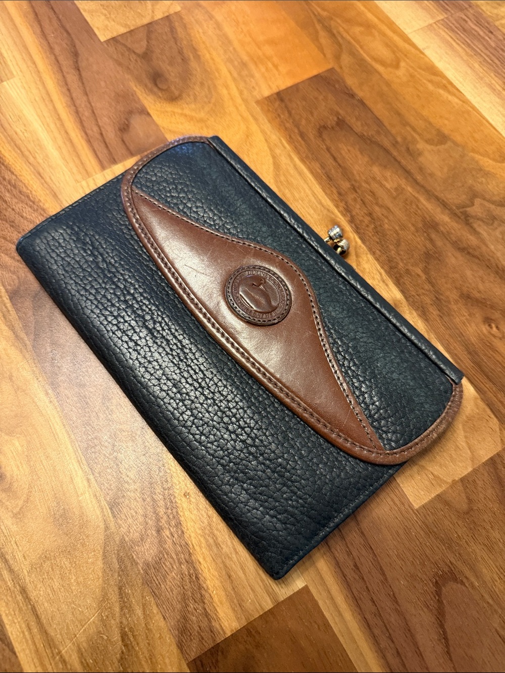 Dooney & Bourke Black Pebbled Leather Wallet with Brown Trim